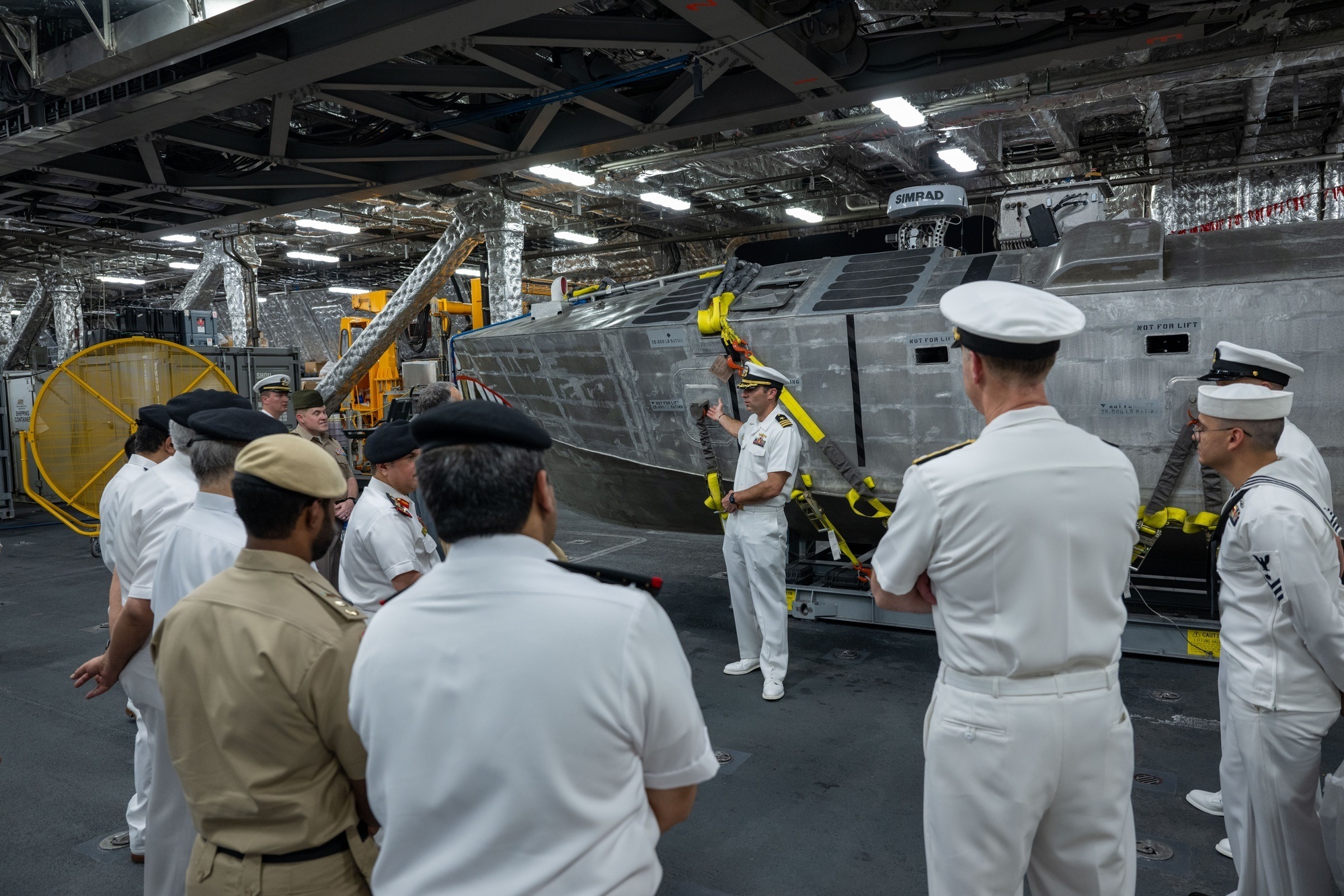 Mine-countermeasures unmanned surface vehicle inside USS Canberra’s mission bay.